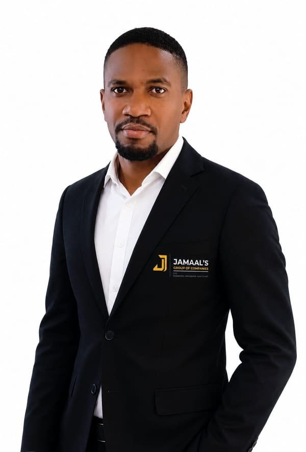 Kareem Jamaal Lewis, founder of Jamaal's Group of Companies, in a jacket carrying the group's mark